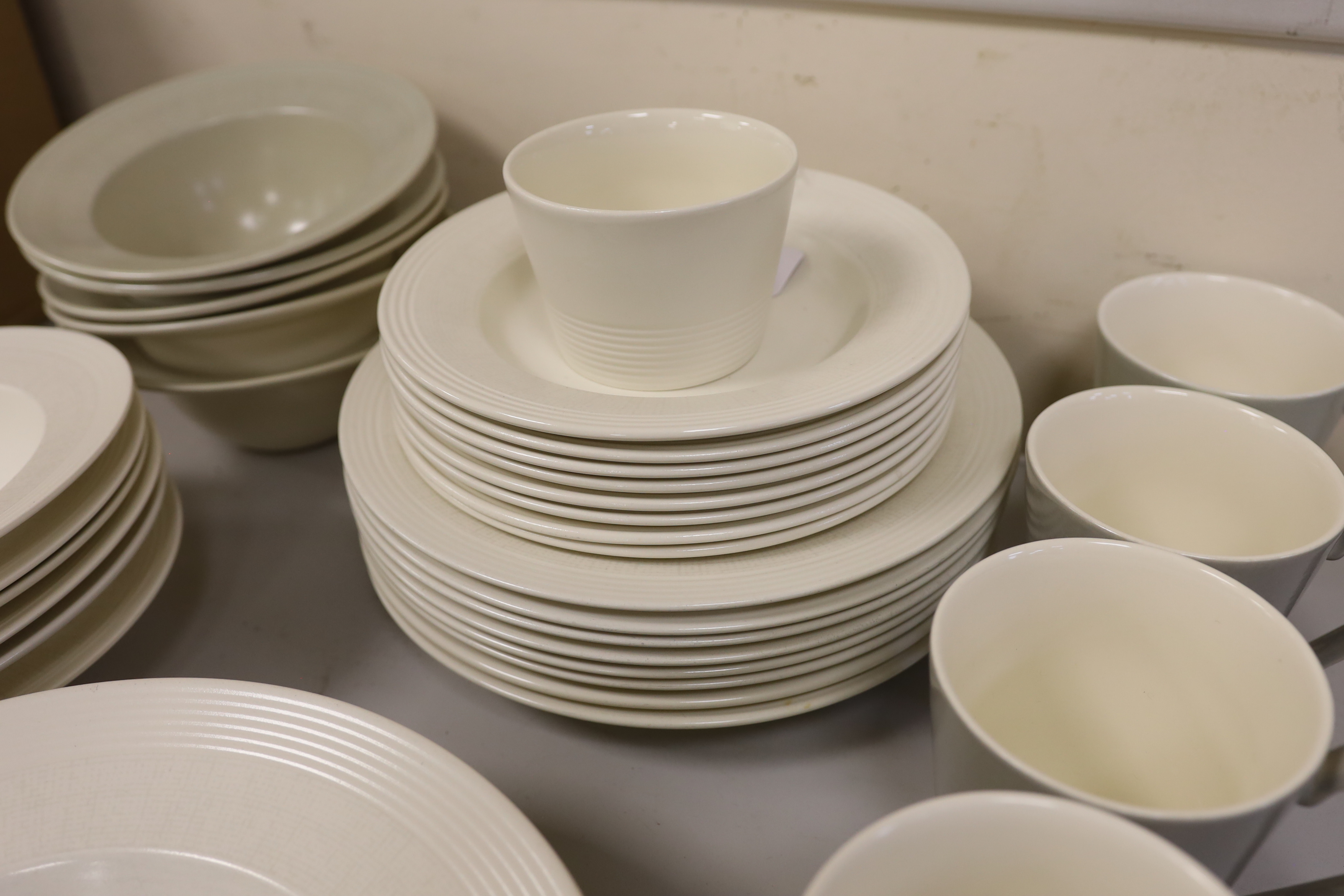 Paul Costelloe for Wedgwood, a part dinner set including six mugs, six bowls and eight dinner plates